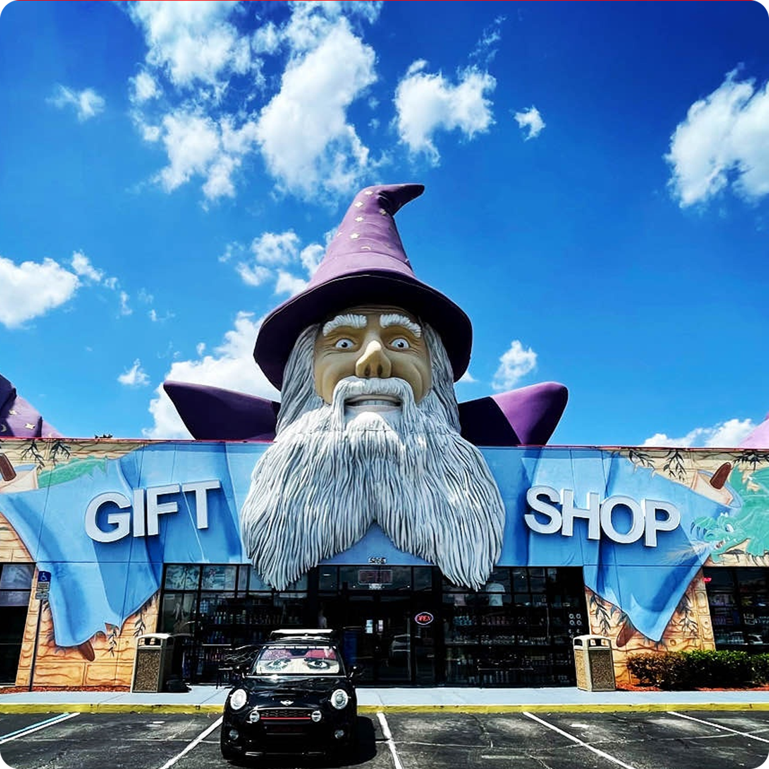 image of a gift shop in orlando with a wizard on top of it
